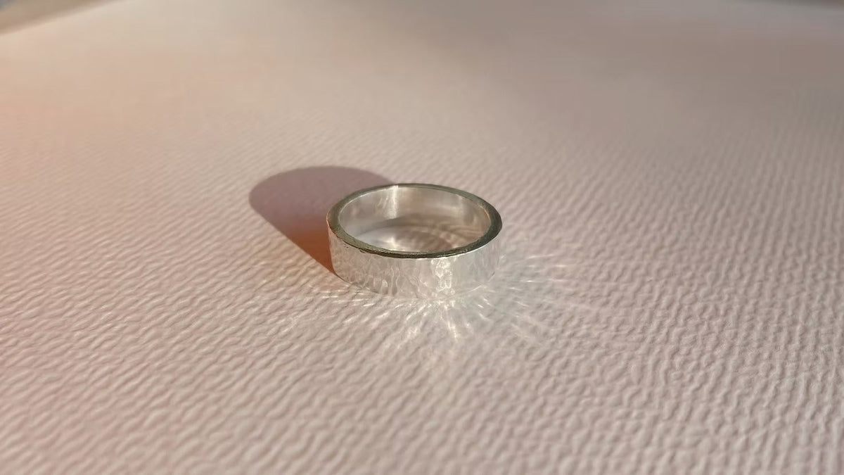 a chunky silver ring for men or women with a soft hammered surface 