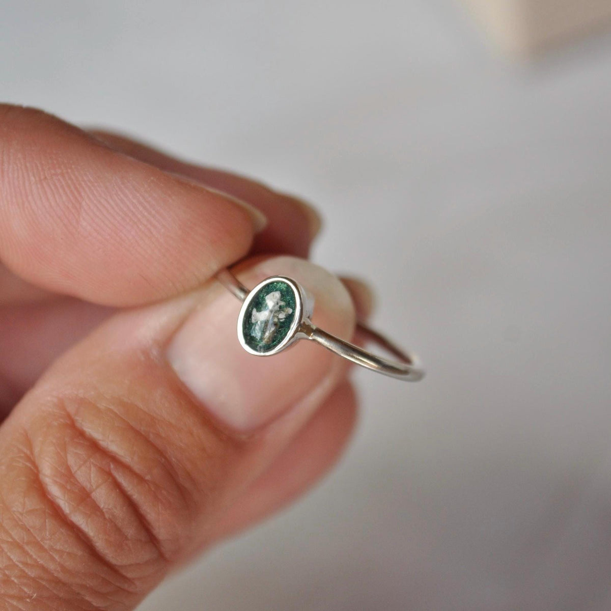 Small oval sterling silver memorial ring with green keepsake setting | Mila Faith